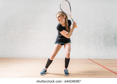 Squash game training, female player with racket