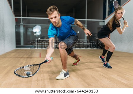 Squash game training, players with rackets