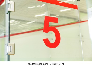 Squash Room Number 5 In The Tennis Club. The Number On The Glass Door. Horizontal Photo