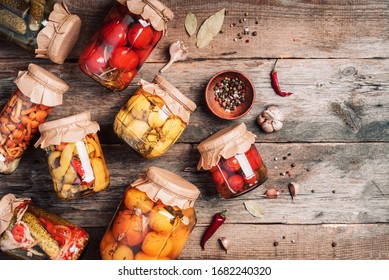 Сucumber, Squash And Tomatoes Pickling And Canning Into Glass Jars. Ingredients For Vegetables Preserving. Healthy Fermented Food Concept. Top View. Copy Space.