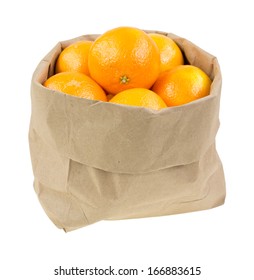 A Squat Paper Bag Filled With Small Naval Oranges On A White Background.