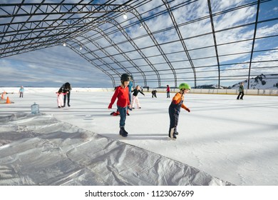 SquawValley, CA - December 29, 2009: Kids Skating On An Ice Rink At A Resort Where 1960 Winter Olympics Were Held. 