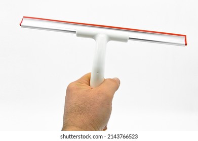 Squeegee with red silicone tip used as cleaning equipment, isolated on white background - Shutterstock ID 2143766523
