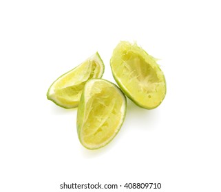 Squeezed limes isolated on white background