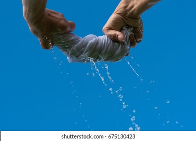 Squeezing Wet Cloth Against Blue Sky Stock Photo 675130423 | Shutterstock
