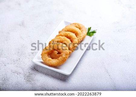 squid a la romana, fried in a rustic atmosphere