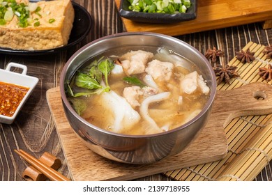 Squid Soup Slabs In A Bowl Isolated On Wooden Board Side View On Table Taiwan Food