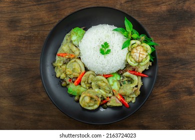 Squids with Green Curry Served Rice recipe Thaifood fusion Style decoration carved eggplant topview - Shutterstock ID 2163724023