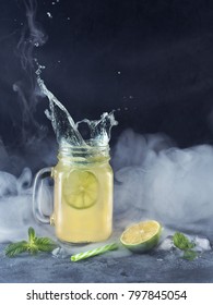 Squirt Of Lemonade With A Smoke Effect With Lime And Mint Closeup