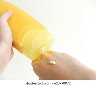 Squirting Suncream On Hand