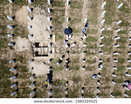 Srebrenica, Bosnia and Herzegovina: Aerial drone view of gravestones in Memorial centre Potocari, Srebrenica. Cemetery for the victims of the 1995 genocide. Graves. Funeral of victims. 
