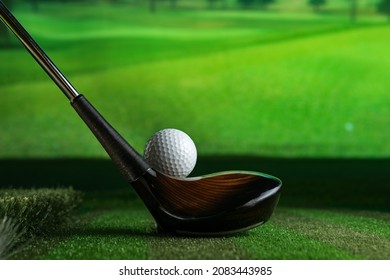 Sreen golf. Putter and golf ball on the background of the screen. - Shutterstock ID 2083443985