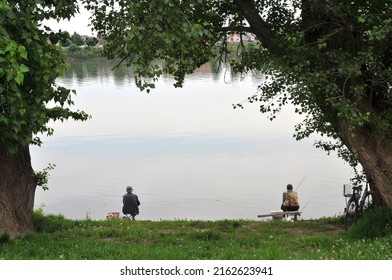 Sremska Mitrovica, Serbia - May 7, 2022: Fishermen enjoy in relaxing fishing on the Sava River, on a beautiful spring weather