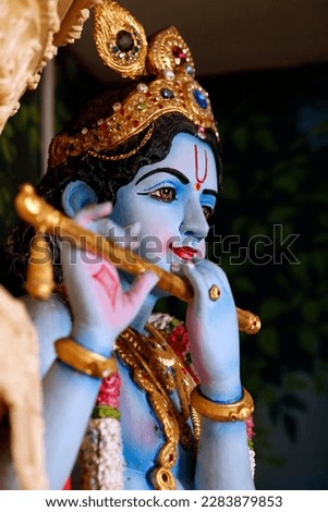 Sri Krishnan hindu temple.  Hindu God Lord Krishna playing musical instrument flute.  Singapore. 