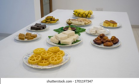 Sri Lanka Avurudu table, Kavum, Kokis, Oil lamp, Aluva, awurudu celebration, kiribath