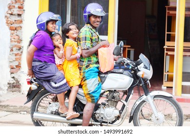 SRI LANKA, CANDY - MARCH 04, 2013

Sri Lankan Family Of Four People On A Motorcycle