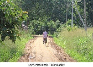 Sri Lankan Man Riding  A Bicycle