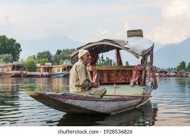 SRINAGAR, INDIA 21 - JULY, 2018 : Lifestyle in Dal lake, local people use shikara boat, a small boat for transportation in the lake of Srinagar, Jammu and Kashmir state, India
