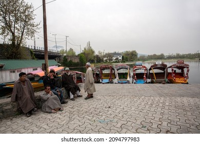 SRINAGAR, INDIA - APRIL 13: Dal Lake, The second largest in the state, Local people and traveler are use small wooden boat call 'Shikara' is a vehicle in the lake on Apr 13, 2014
