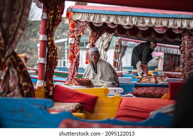 SRINAGAR, INDIA - APRIL 13: Unidentified man at Dal Lake, The second largest in the state, Local people and traveler are use small wooden boat call 'Shikara' is a vehicle in the lake on Apr 13, 2014