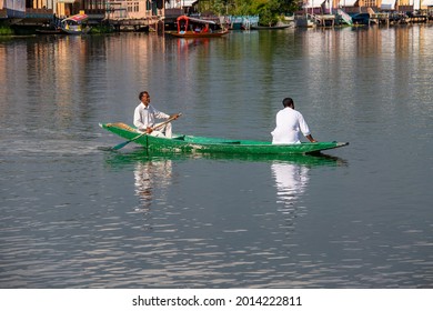 Srinagar, India - july 02, 2015 : Lifestyle in Dal lake, local people use Shikara, a small boat for transportation in the lake of Srinagar, Jammu and Kashmir state, India. Indian men on a boat