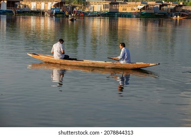 Srinagar, India - july 02, 2015 : Lifestyle in Dal lake, local people use Shikara, a small boat for transportation in the lake of Srinagar, Jammu and Kashmir state, India. Indian men on a boat