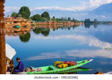 SRINAGAR, INDIA - October 2017: Floating flower market on Dal lake in Srinagar, India. Boat on the water full of flowers for sale in Srinagar, Kashmir, India