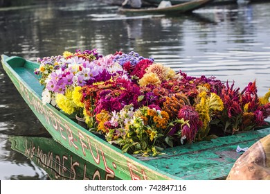 SRINAGAR, INDIA - October 2017: Floating flower market on Dal lake in Srinagar, India. Boat on the water full of flowers for sale in Srinagar, Kashmir, India