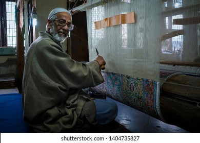 Srinagar, Jammu and Kashmir - April 18, 2019 : Traditional Kashmiri handmade persian carpets weaves making carpet is a native weaving craft of Kashmir skilled weavers highly quality