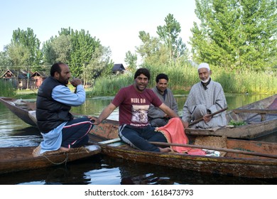 Srinagar, Jammu and Kashmir - April 28 2018: Salesman selling vegetables from their boat in the open floating market in dal lake gathered to take for pictures.