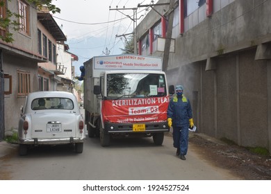 Srinagar, Jammu And Kashmir India 07 August 2020. Kit Wearing Frontline Warriors Sanitising Streets Houses And Parts Of Srinagar City. SMC Srinagar Is Doing Good Fumigation In Covid-19 Time.