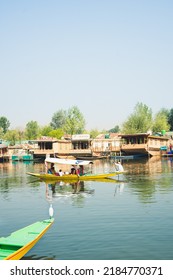 Srinagar, Jammu and Kashmir, India - June 10 2022: Lifestyle in Dal lake, People living in 'House boat' and using small boat 'Shikara' for transportation.
