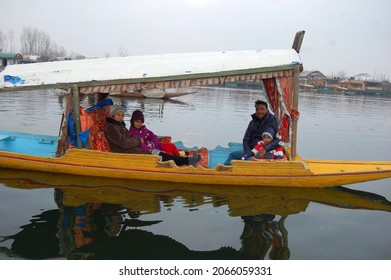 Srinagar, Jammu Kashmir, India - March 2014 : Tourists enjoying a boat ride in Dal lake, Srinagar, blurry shot