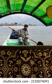 Srinagar, Jammu and Kashmir, India - March 1 2022: A portrait of a Kashmiri Shikara boat sailor Indian man on Dal Lake.