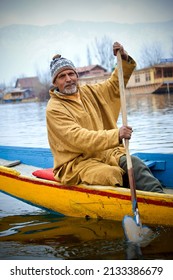 Srinagar, Jammu and Kashmir, India - March 1 2022: A portrait of a Kashmiri Shikara boat sailor Indian man on Dal Lake.
