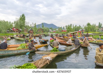 SRINAGAR KASHMIR - CIRCA APRIL 2016 - Unidentified vegetable sellers taking their produce to the Dal Lake early morning floating market. 