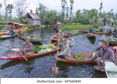 SRINAGAR KASHMIR - CIRCA APRIL 2016 - Unidentified vegetable sellers taking their produce to the Dal Lake early morning floating market. 