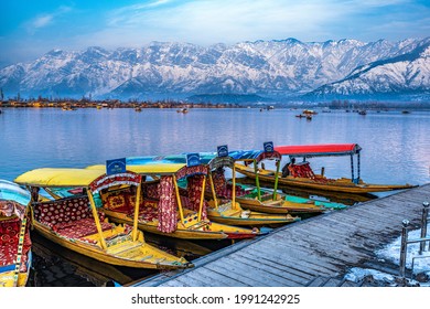 Srinagar, Kashmir, India - January 28, 2021 : Beautiful view of the colorful Shikara boats floating on Dal Lake, Srinagar, Kashmir, India.