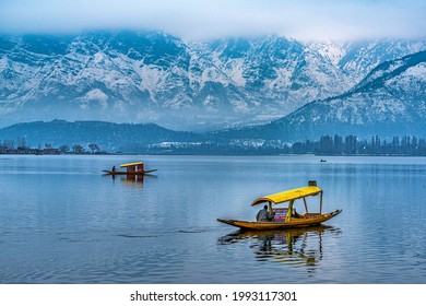 Srinagar, Kashmir, India - January 28, 2021 : A view of Dal Lake in winter, and the beautiful mountain range in the background in the city of Srinagar, Kashmir, India.