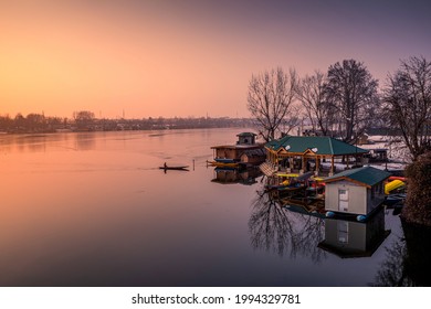 Srinagar, Kashmir, India - January 29, 2021 : A sunset view of Nigeen Lake in winter season, Srinagar, Kashmir, India.