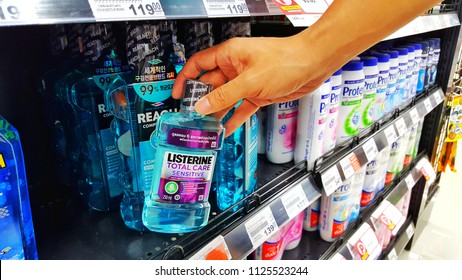 Sriracha, Chonburi THAILAND June 29, 2018: Man's Hands Are Buying Effective Mouthwash Brand Listerine In A Supermarket.