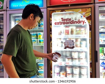 Sriracha, Chonburi THAILAND Mar 9, 2019: Man Is Holding Häagen-Dazs Ice Cream Cup From Supermarket Refrigerator.