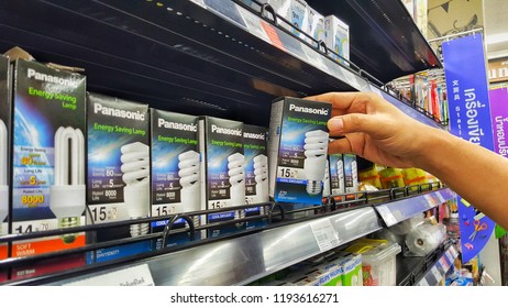 Sriracha, Chonburi THAILAND Sep 18, 2018: Man's Hand Is Holding Lamp Box (Panasonic Brand) From The Supermarket Shelf