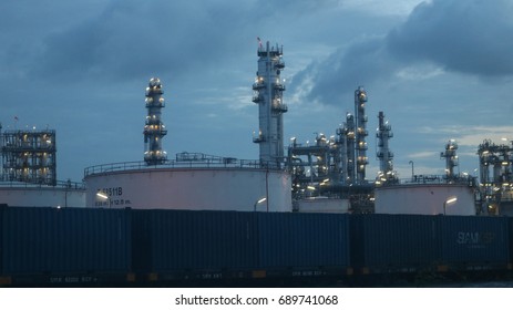 Sriracha, Chonburi-Thailand, Aug 04 2017:The Railway Carriage Container In The Twilight Morning With Nearby Oil Refinery At Sriracha In Thailand.