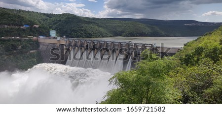 Srisailam Dam, Andhrapradesh / India - Dec 15, 2019 : Dam on Krishna River flowing between Andhra  and Telangana. 9 Gates of the Dam were open. 