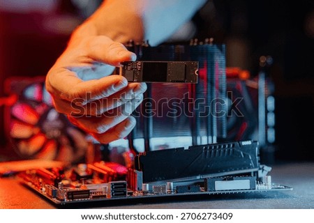 SSD M2 disk close up with selective focus on the interface. On dark background with reflection