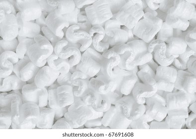 S-shaped White Packing Peanuts As A Background