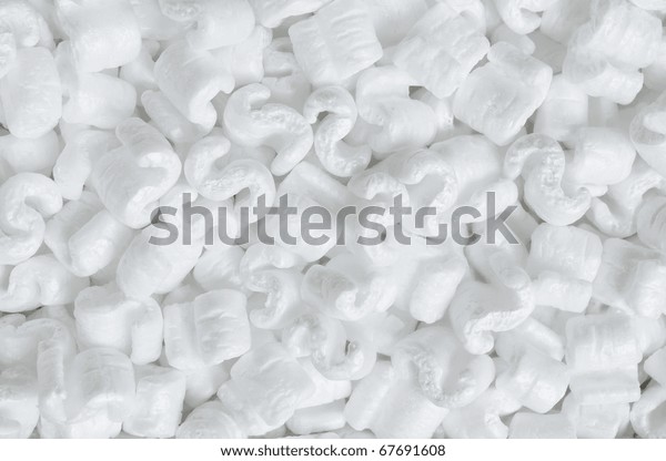 S-shaped white\
packing peanuts as a\
background