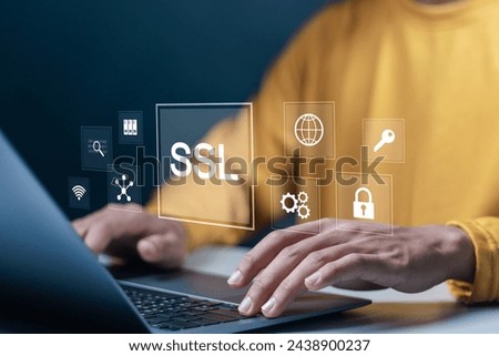SSL, Secure Socket Layer concept. Data encryption technology to increase the security of communication or data transmission on network. Person using laptop with SSL icon on virtual screen.