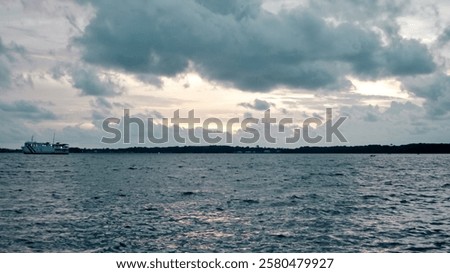 Similar – Image, Stock Photo Serene twilight seascape with pastel reflections